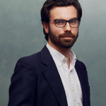 Meet the Team of experts - Photo of Fabrice Van Boeckel, person in business suit, glasses with dark frames, smiling, male, gallantly, standing upright
