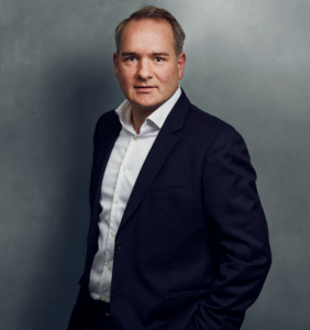 Meet the Team of experts - Photo of Martin Seegers, person in business suit, smiling, male, gallantly, standing upright