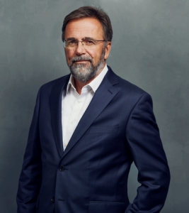 Meet the Team of experts - Photo of Ulrich Classen, person in business suit, glasses, smiling, bearded men, gallantly, standing upright